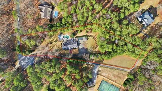 a backyard of a house with lots of green space