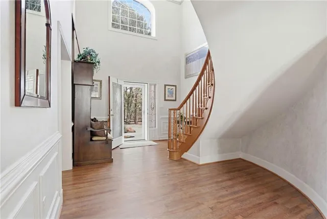 a living room with furniture and a dining table