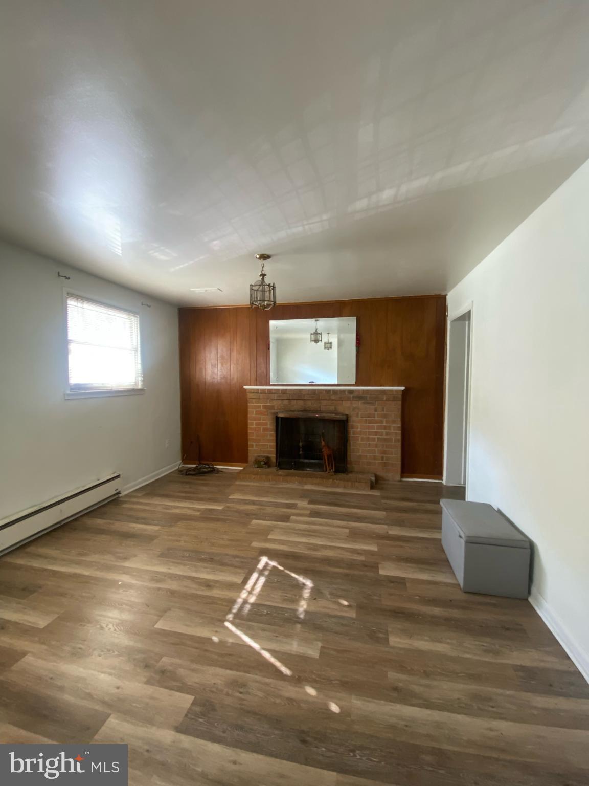 9601 East Light Drive Silver Spring, MD 20903 - Photo 15 of 25 a view of a livingroom with wooden floor and window