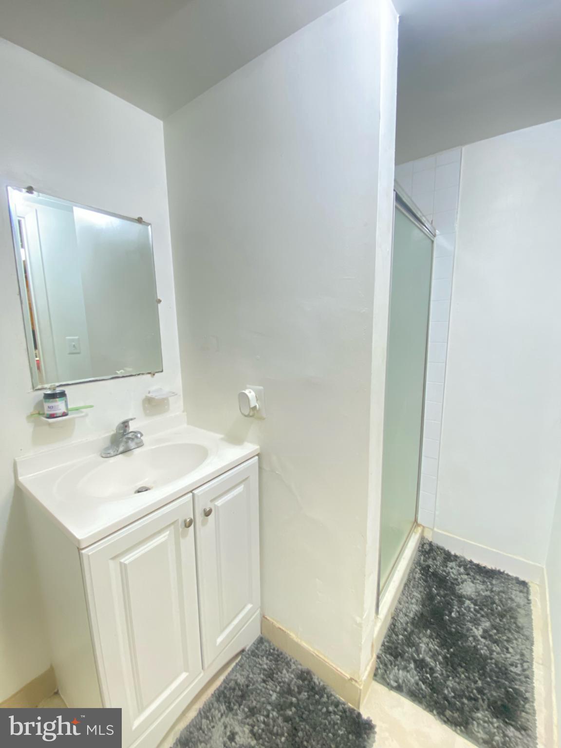 9601 East Light Drive Silver Spring, MD 20903 - Photo 20 of 25 a bathroom with a sink and a mirror