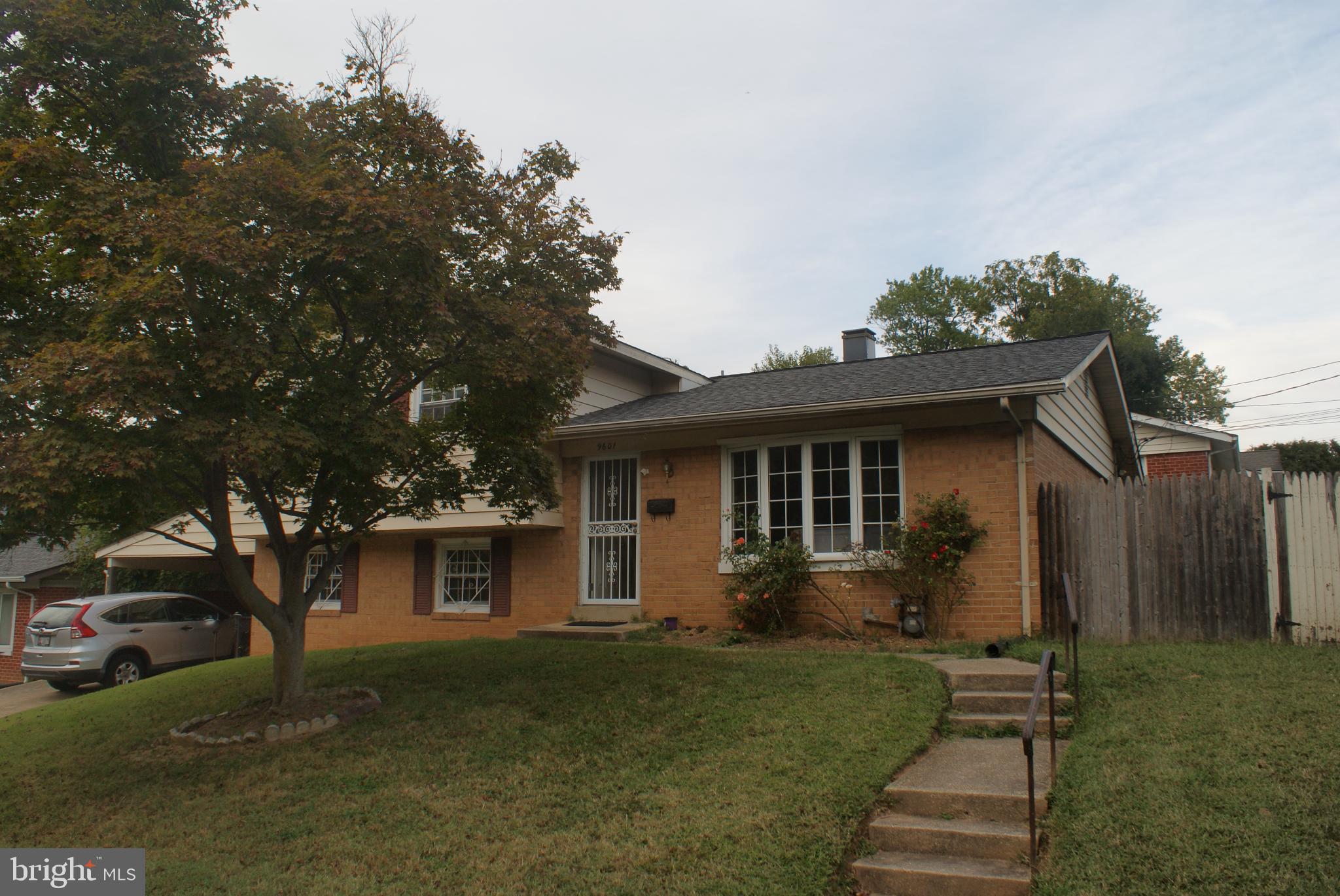 9601 East Light Drive Silver Spring, MD 20903 - Photo 2 of 25 a front view of a house with a garden