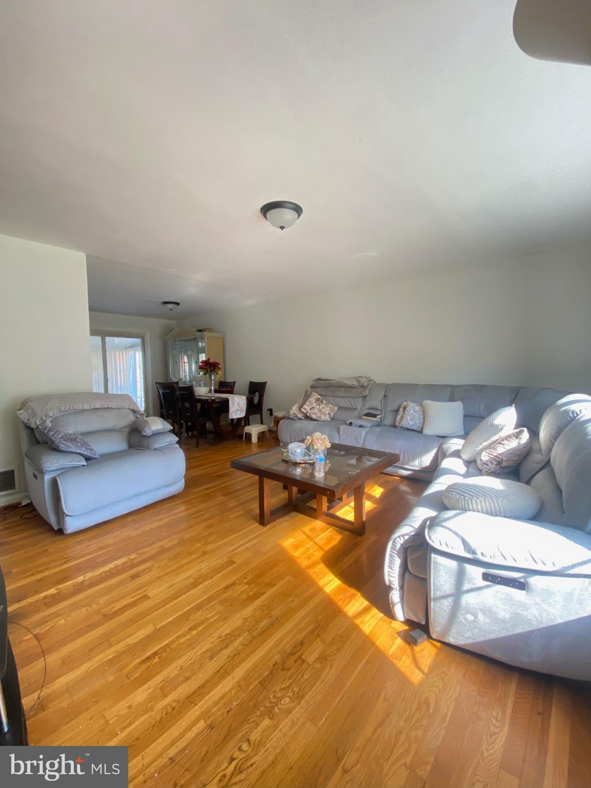 9601 East Light Drive Silver Spring, MD 20903 - Photo 3 of 25 a living room with furniture and a wooden floor