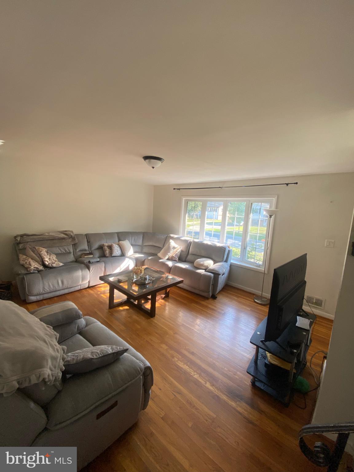 9601 East Light Drive Silver Spring, MD 20903 - Photo 4 of 25 a living room with furniture and a table