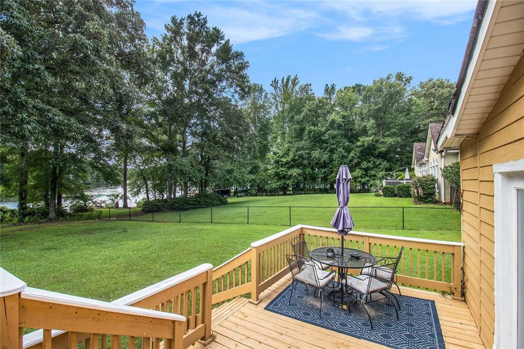 96 Pointe View Court Jackson, GA 30233 - Photo 24 of 36 a view of a deck with a table and chairs