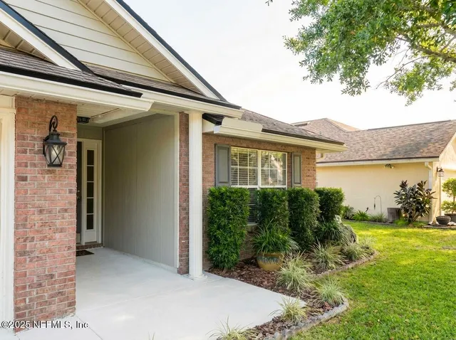 a view of a hallway with a livingroom and storage & utility room