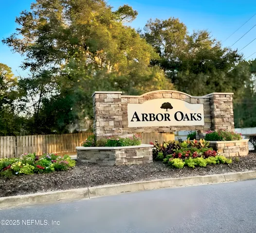 an aerial view of a house with a yard basket ball court and outdoor seating
