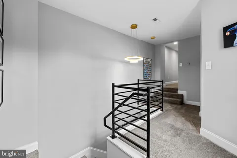 a view of a hallway with chairs