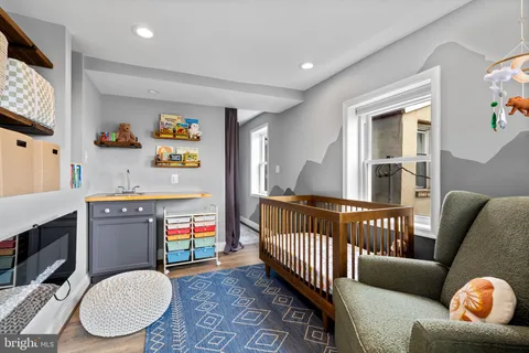 a bedroom with furniture and a window