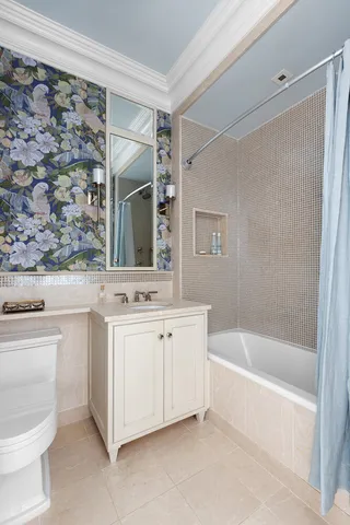 a living room with a bed and a window