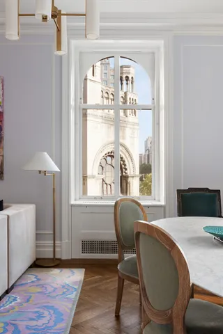 a view of a dining room with furniture and window