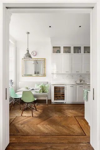 a view of a dining room with furniture window and wooden floor