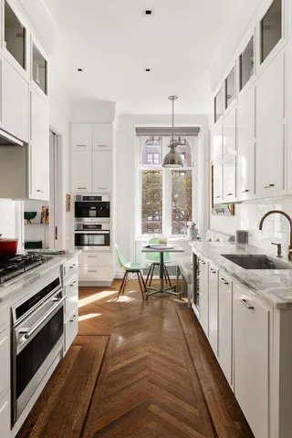 a living room with furniture a fireplace and a table