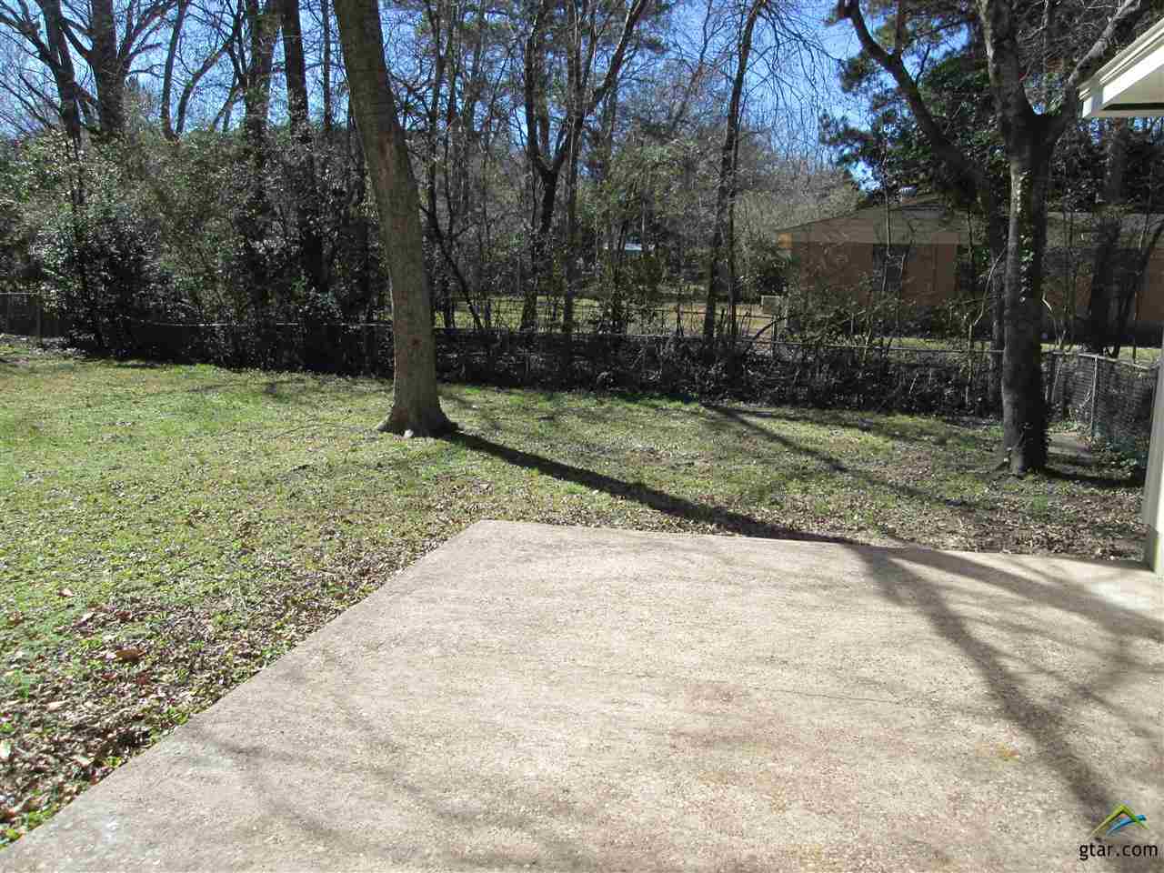 2409 Mimosa Drive Tyler, TX 75701 - Photo 29 of 35 a view of backyard with green space