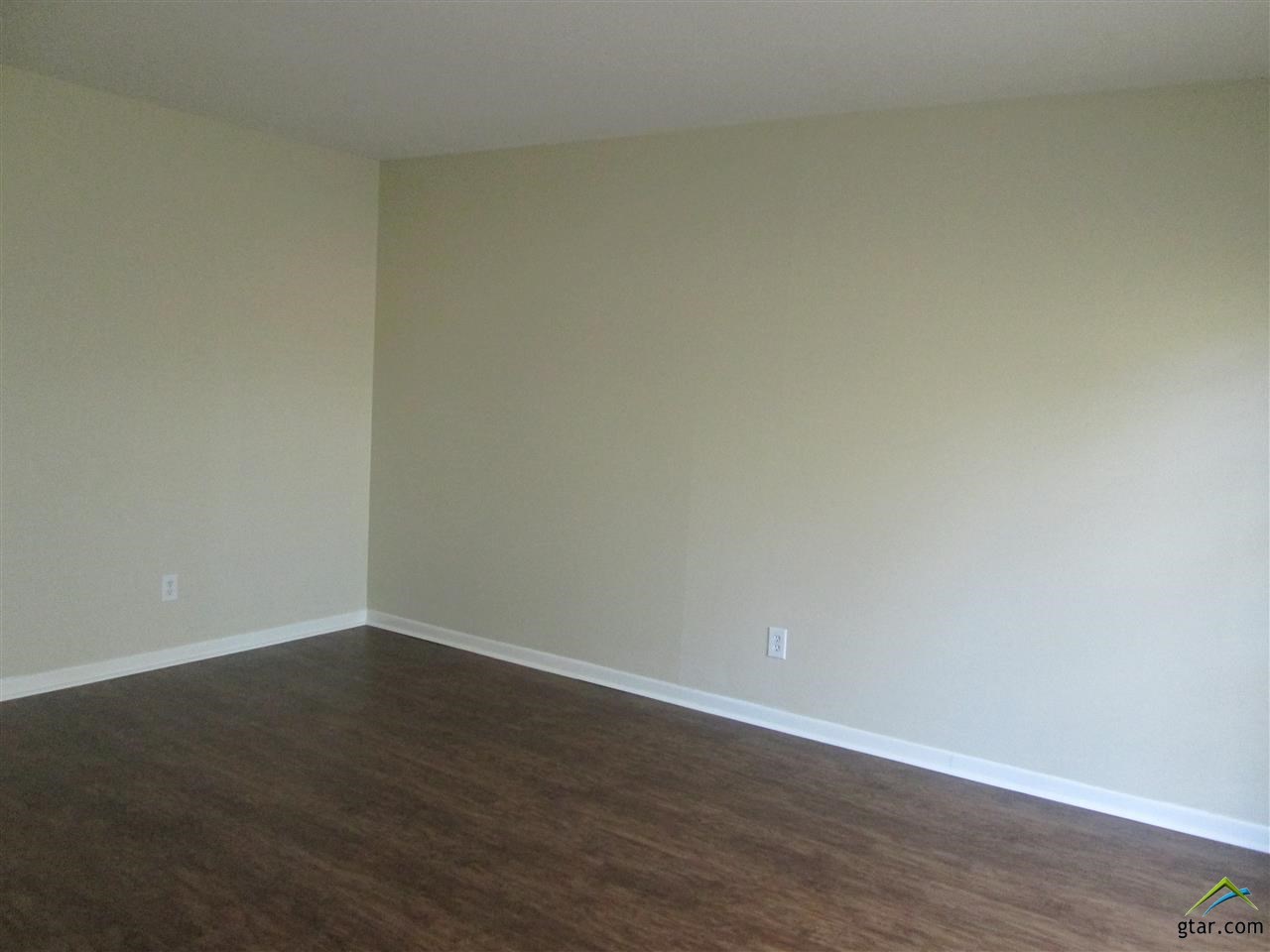 2409 Mimosa Drive Tyler, TX 75701 - Photo 3 of 35 a view of an empty room with wooden floor