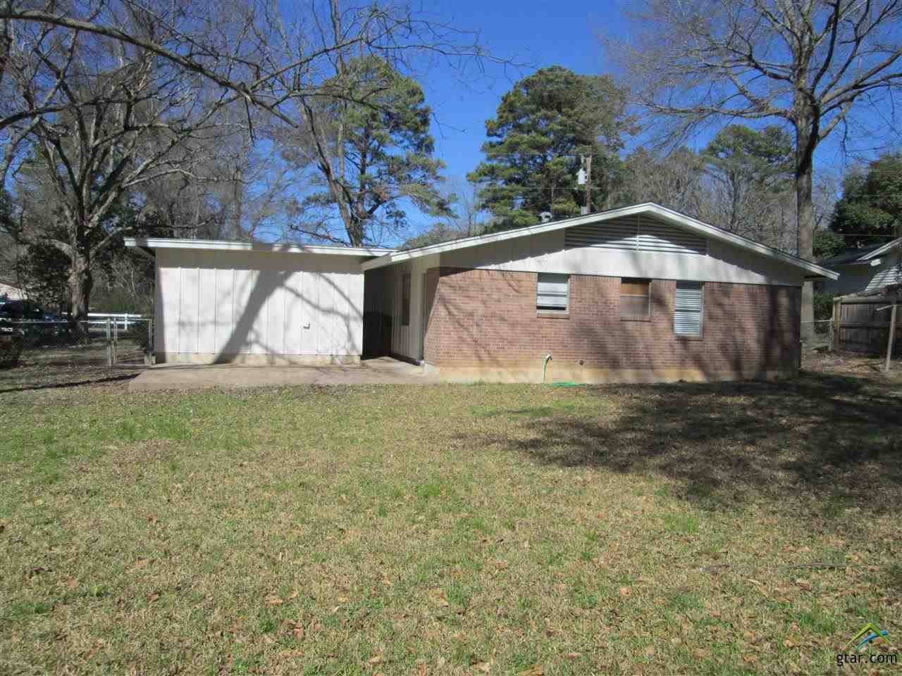 2409 Mimosa Drive Tyler, TX 75701 - Photo 31 of 35 a front view of a house with garden
