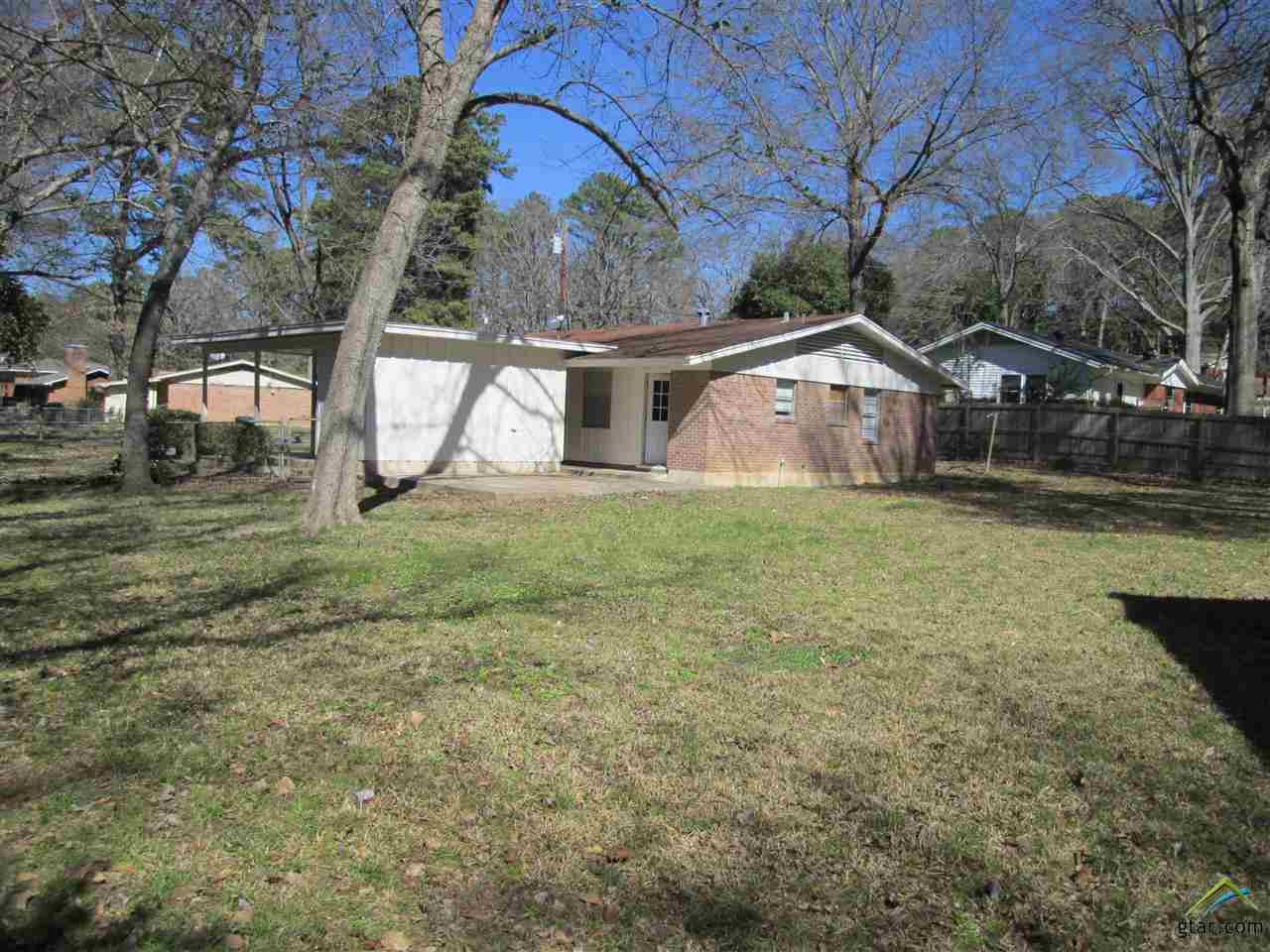 2409 Mimosa Drive Tyler, TX 75701 - Photo 32 of 35 a house that has a tree in front of it