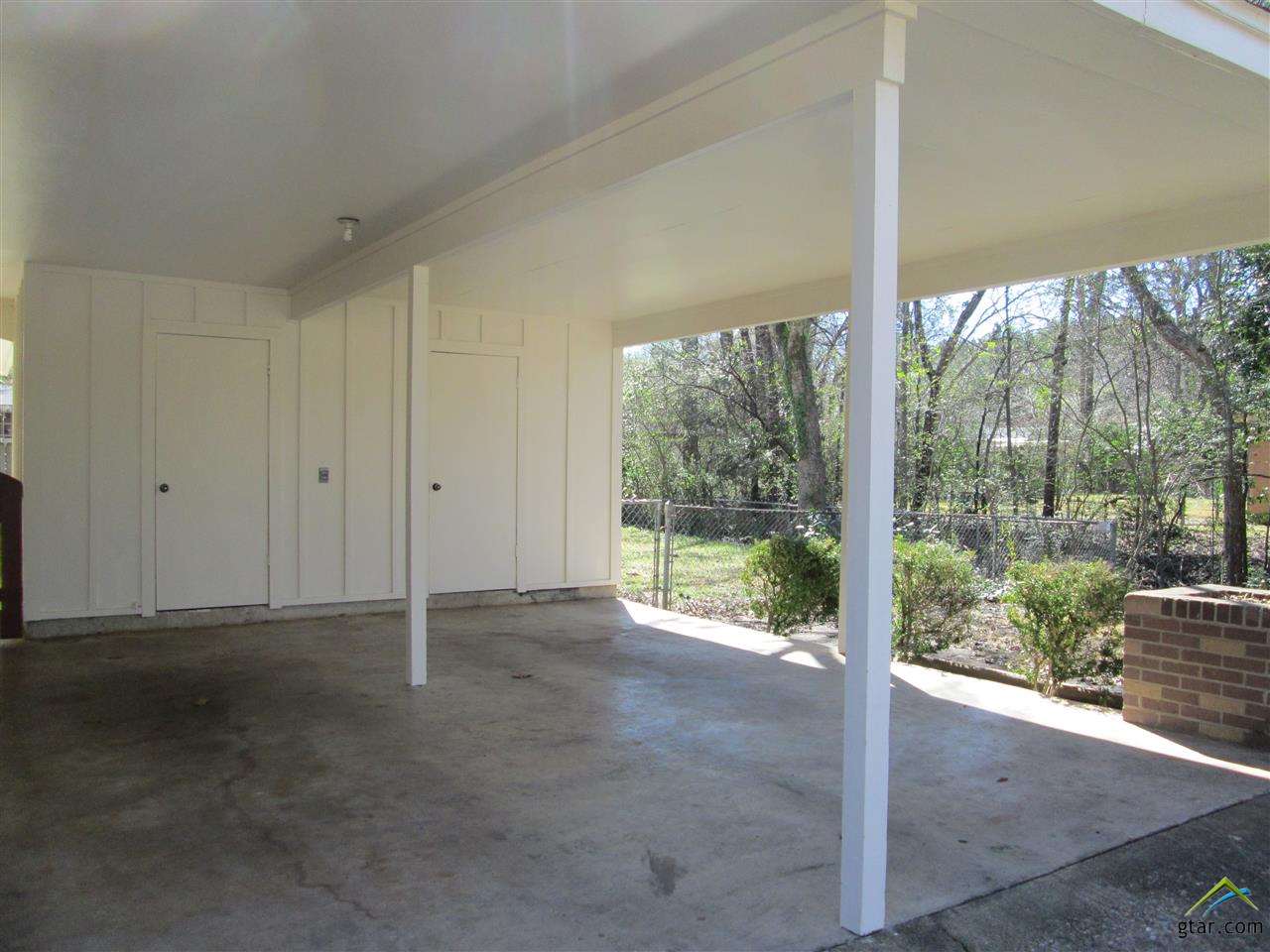 2409 Mimosa Drive Tyler, TX 75701 - Photo 35 of 35 a view of an empty room with wooden door and glass door