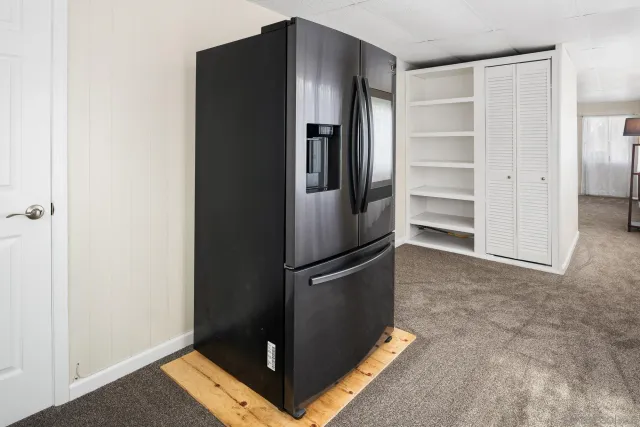 a view of a livingroom with stairs and furniture