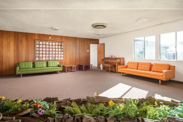 a living room with stainless steel appliances kitchen island granite countertop furniture and a kitchen view