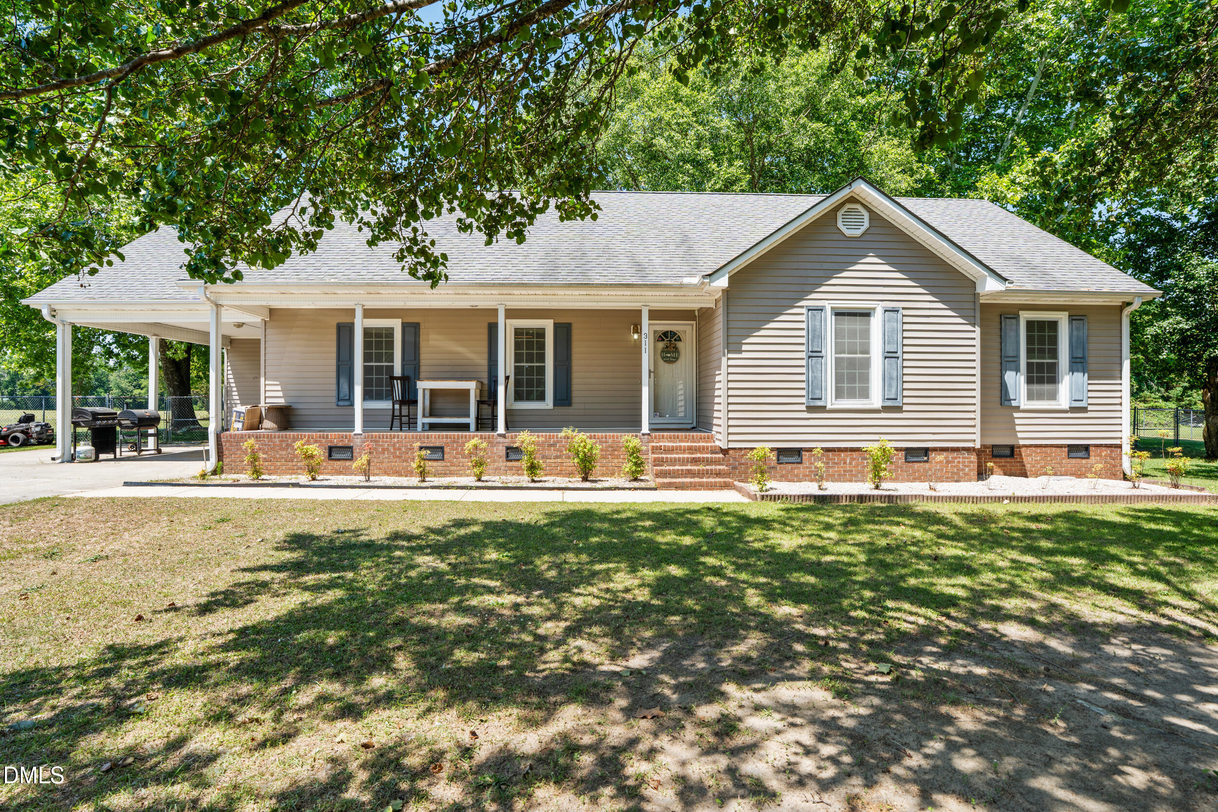 311 Bridgers Road Kenly, NC 27542 - Photo 1 of 46 a front view of house with yard and outdoor seating