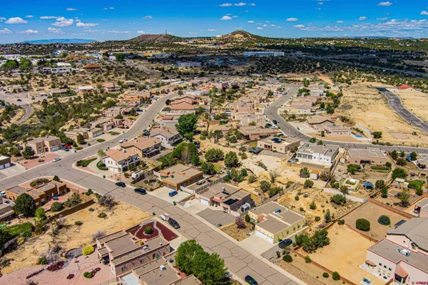 an aerial view of residential building and ocean