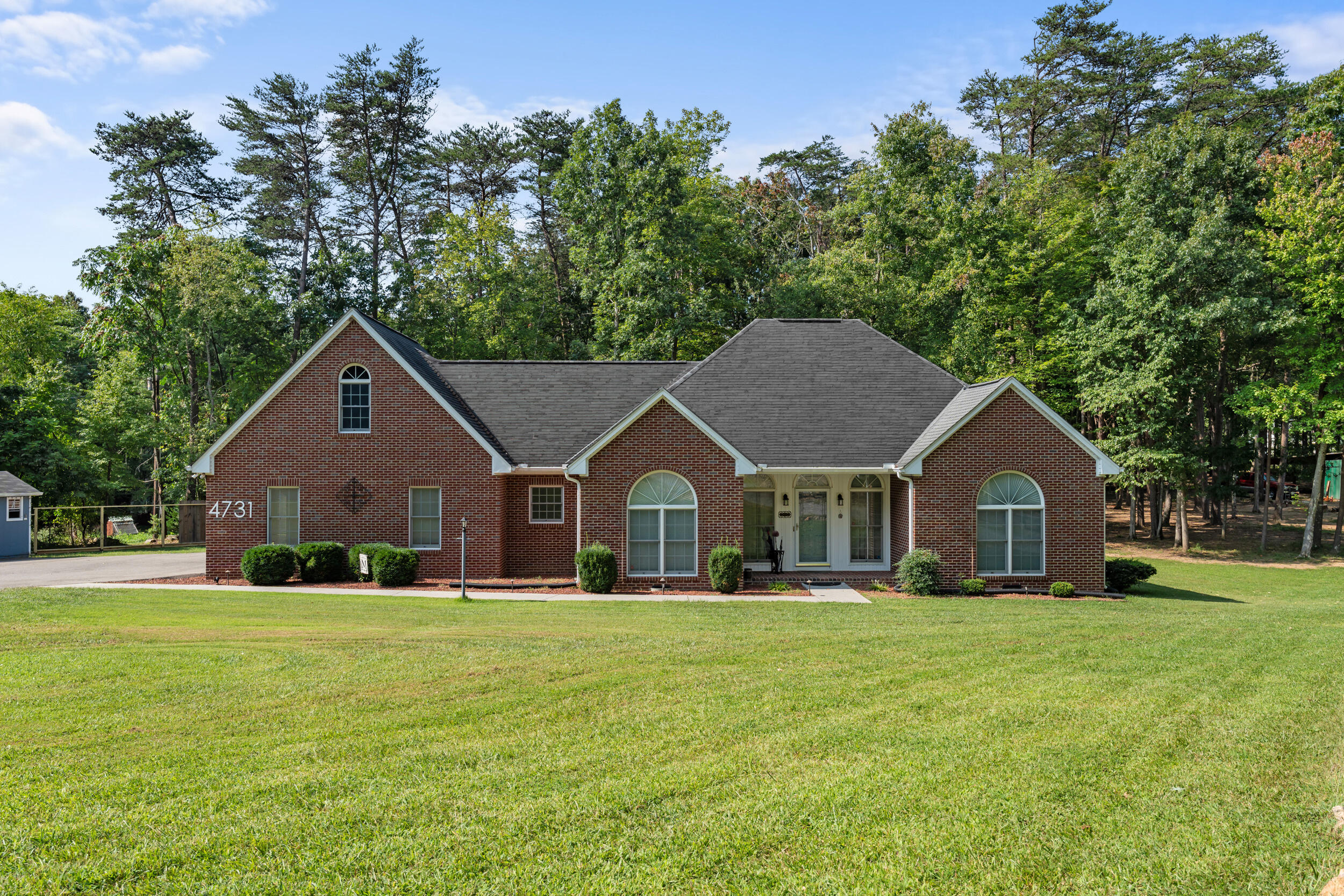 4731 Goodman Road Roanoke, VA 24014 - Photo 38 of 47 a front view of a house with a yard and trees