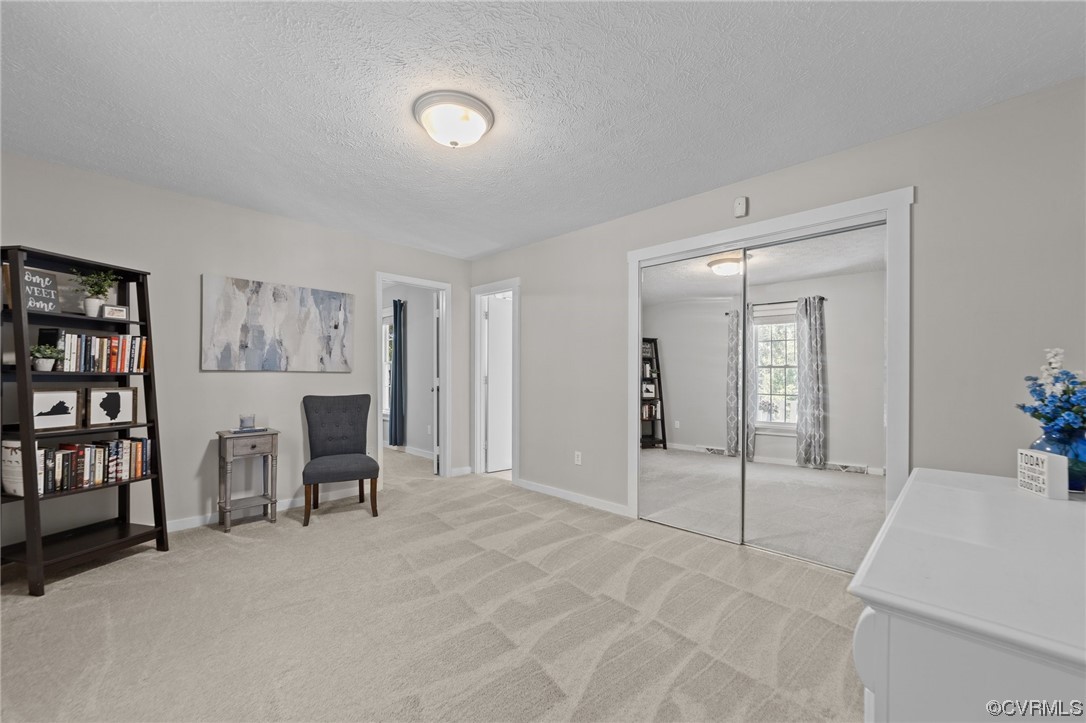 4513 Brookridge Road Chesterfield, VA 23832 - Photo 24 of 50 a spacious bedroom with a bed and a table in it