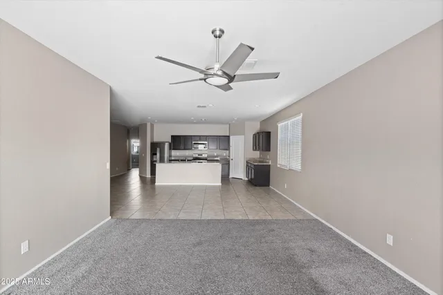 a view of a kitchen with a sink and a window