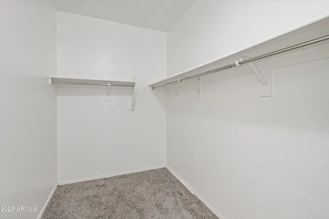 a view of an empty walk in closet