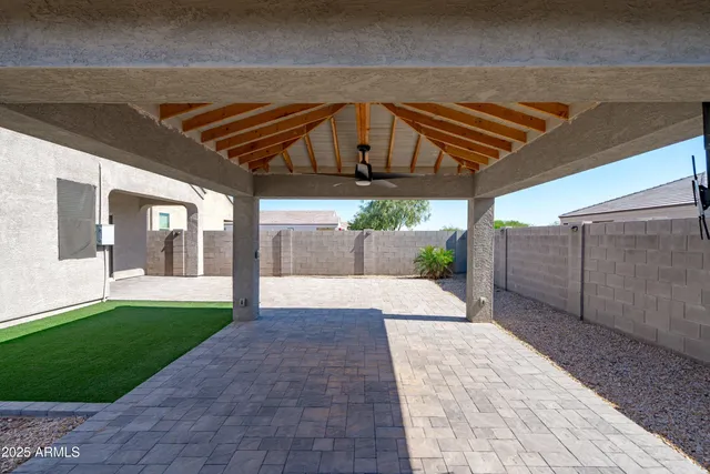 a view of a backyard of the house