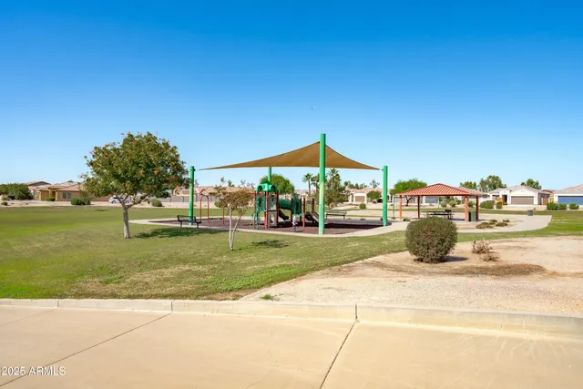 a view of a street with houses on both side of it