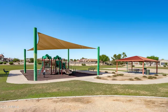 a view of a patio with a table and chairs