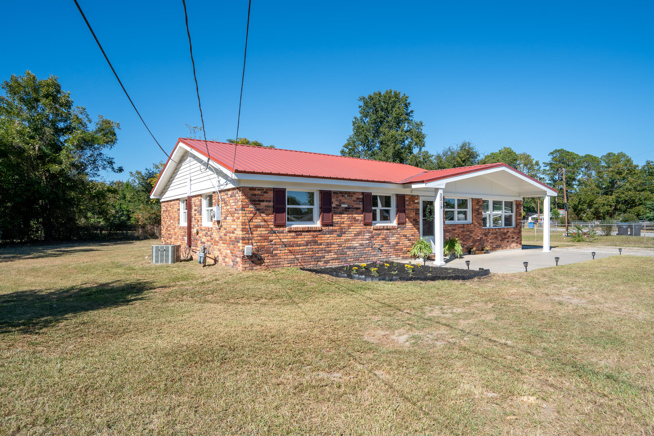 3219 Ronda Drive Augusta, GA 30906 - Photo 2 of 26 a front view of a house with garden