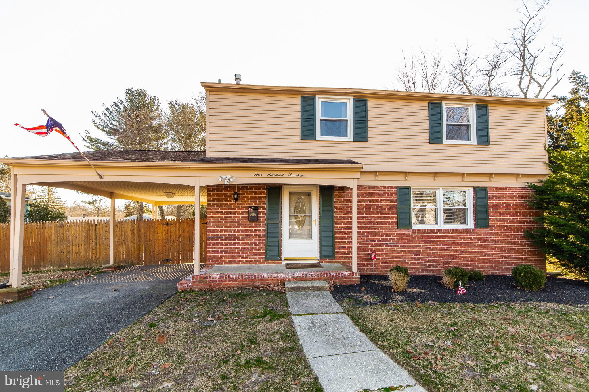 414 Franklin Road Glassboro, NJ 08028 - Photo 1 of 17 a front view of a house with garden
