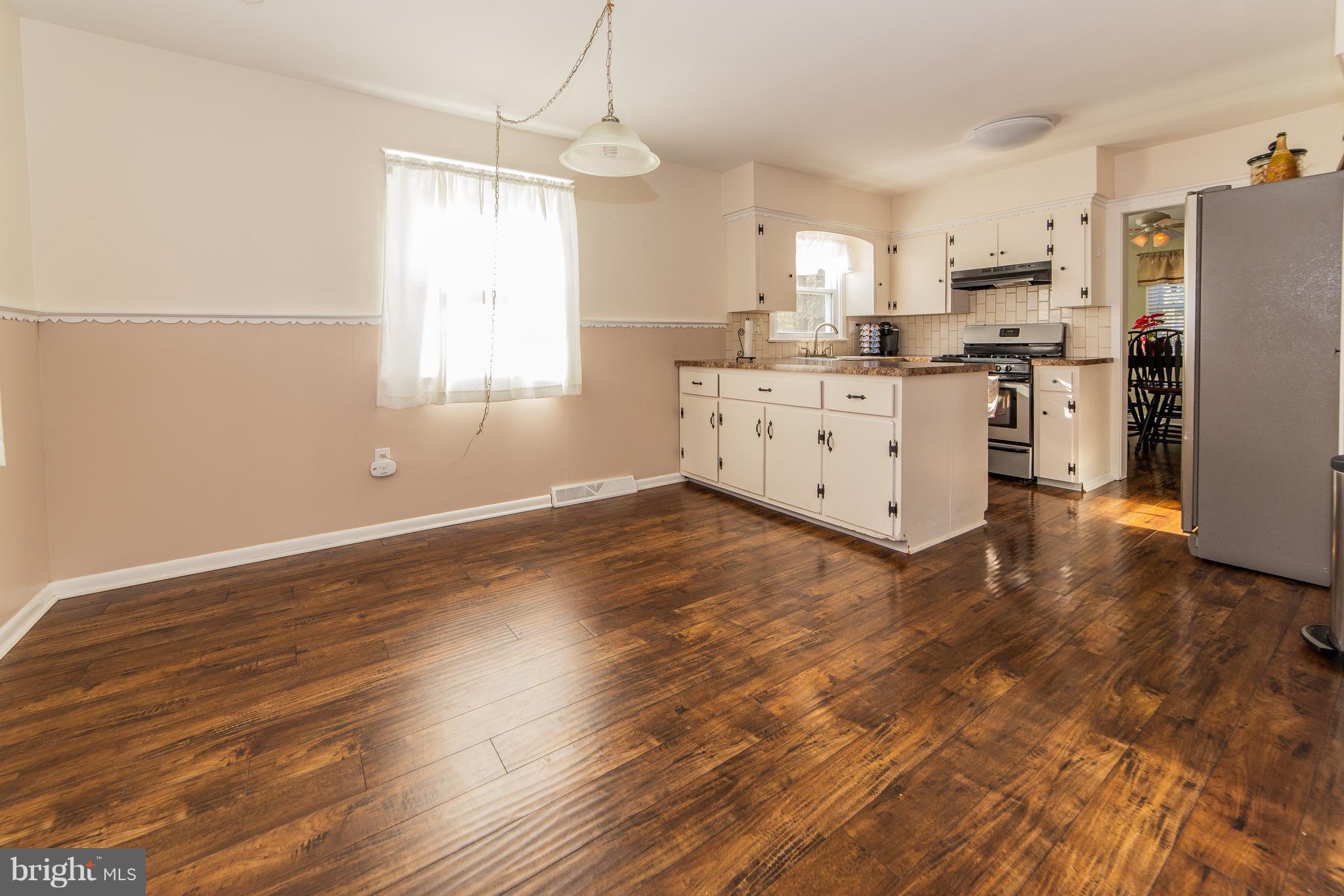 414 Franklin Road Glassboro, NJ 08028 - Photo 4 of 17 a kitchen with stainless steel appliances a refrigerator and a stove top oven