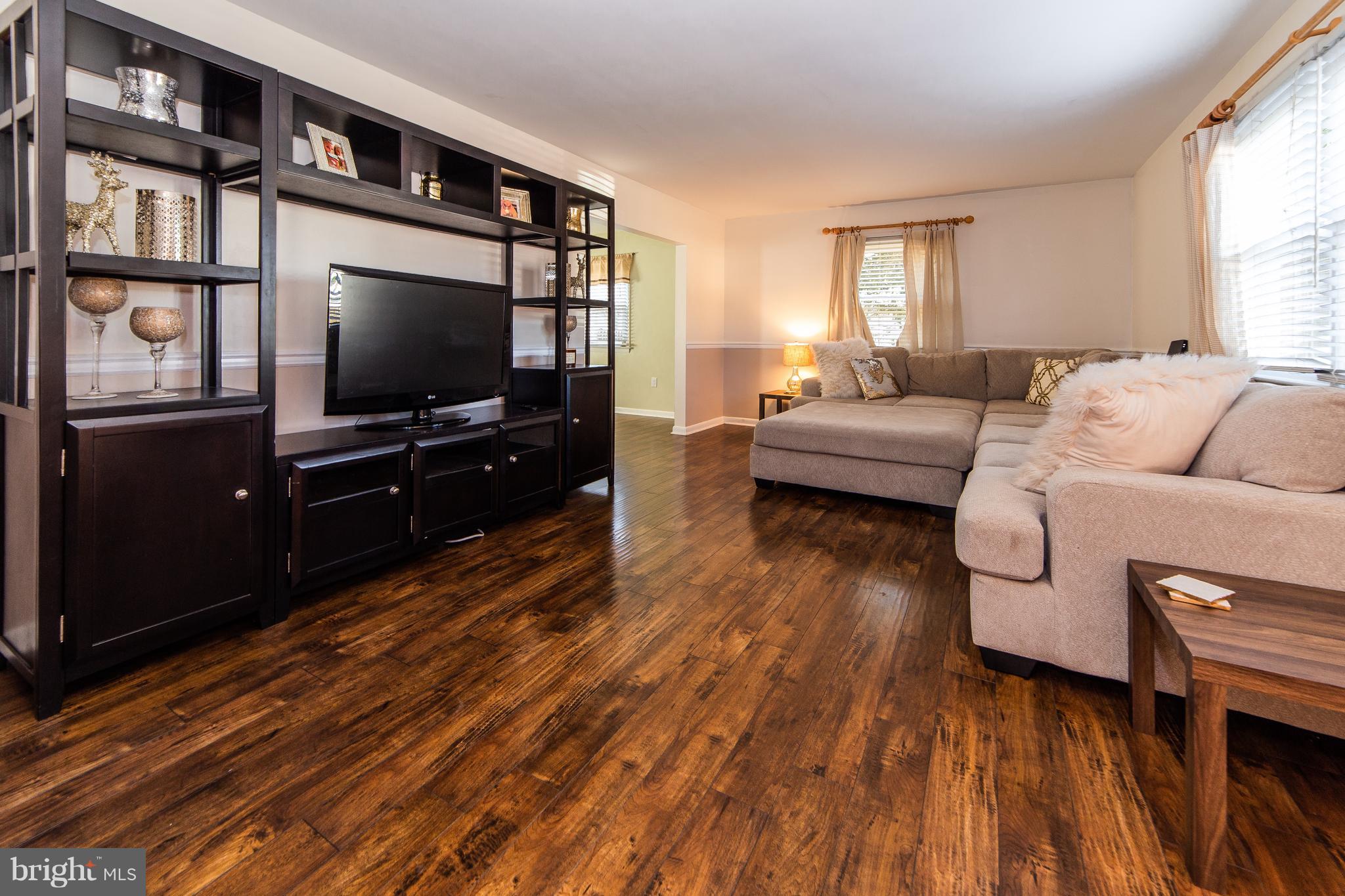 414 Franklin Road Glassboro, NJ 08028 - Photo 5 of 17 a living room with furniture and a flat screen tv