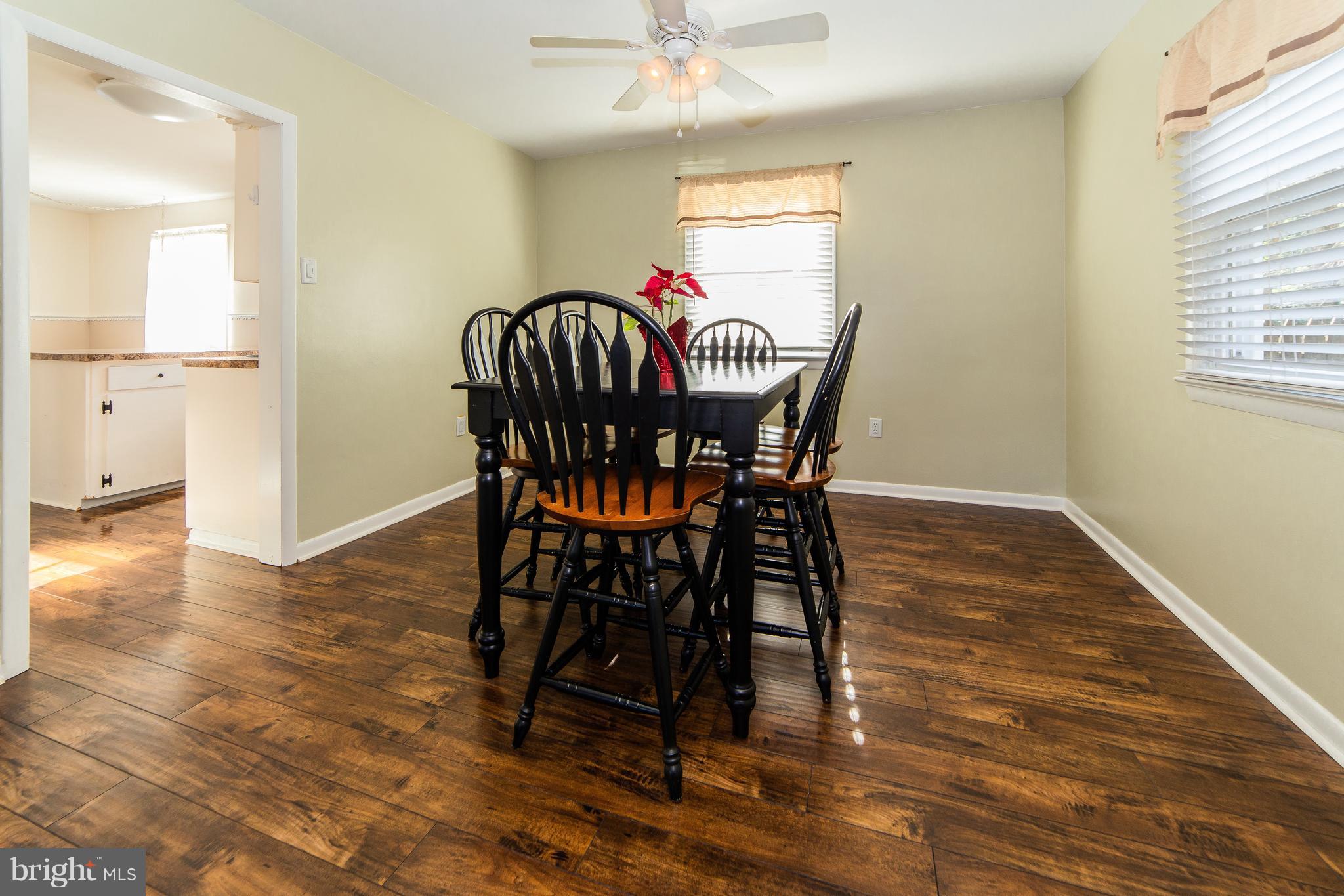 414 Franklin Road Glassboro, NJ 08028 - Photo 8 of 17 a view of a dining room with furniture and wooden floor
