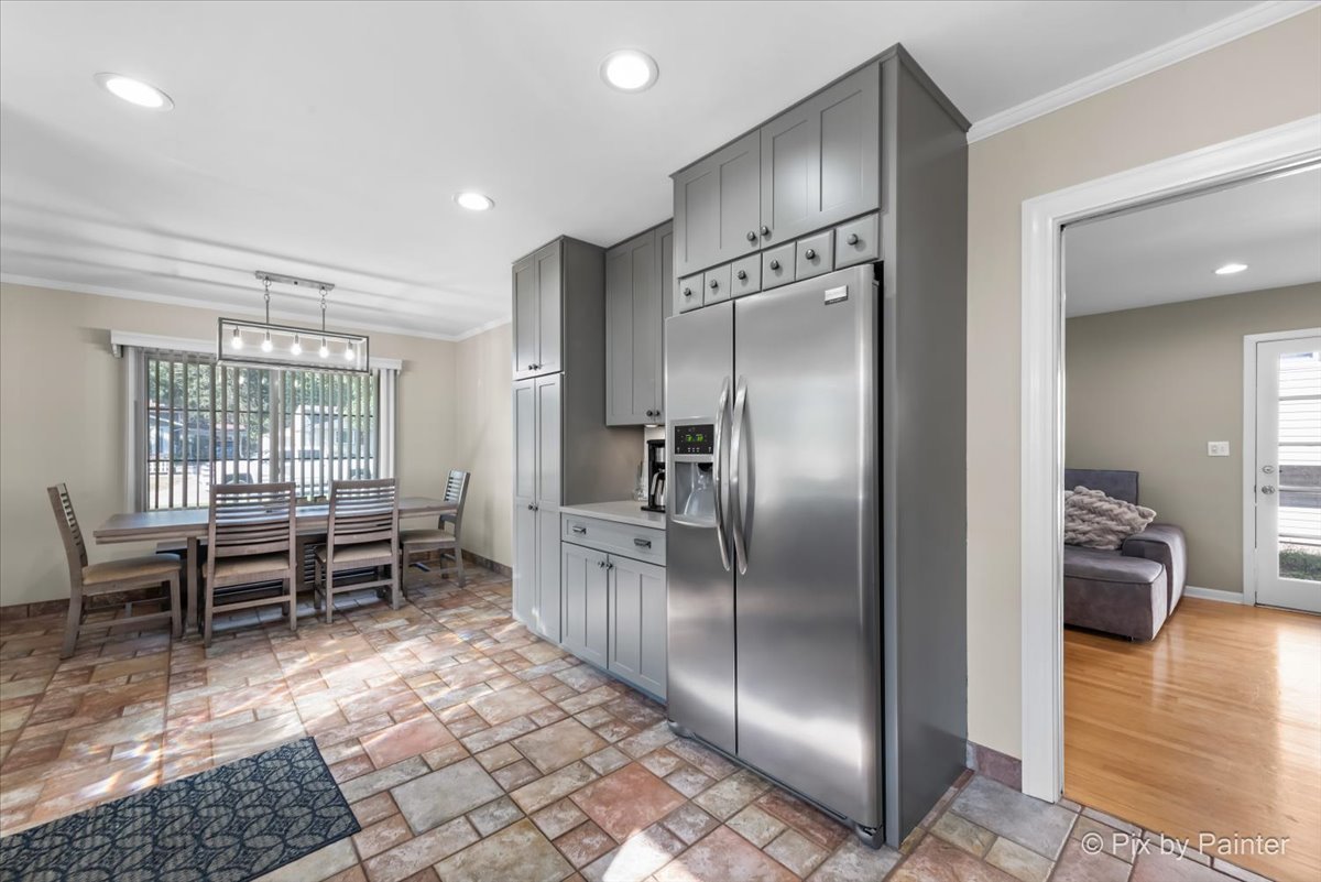 571 Lowden Avenue Glen Ellyn, IL 60137 - Photo 12 of 30 a kitchen with stainless steel appliances granite countertop a refrigerator and cabinets