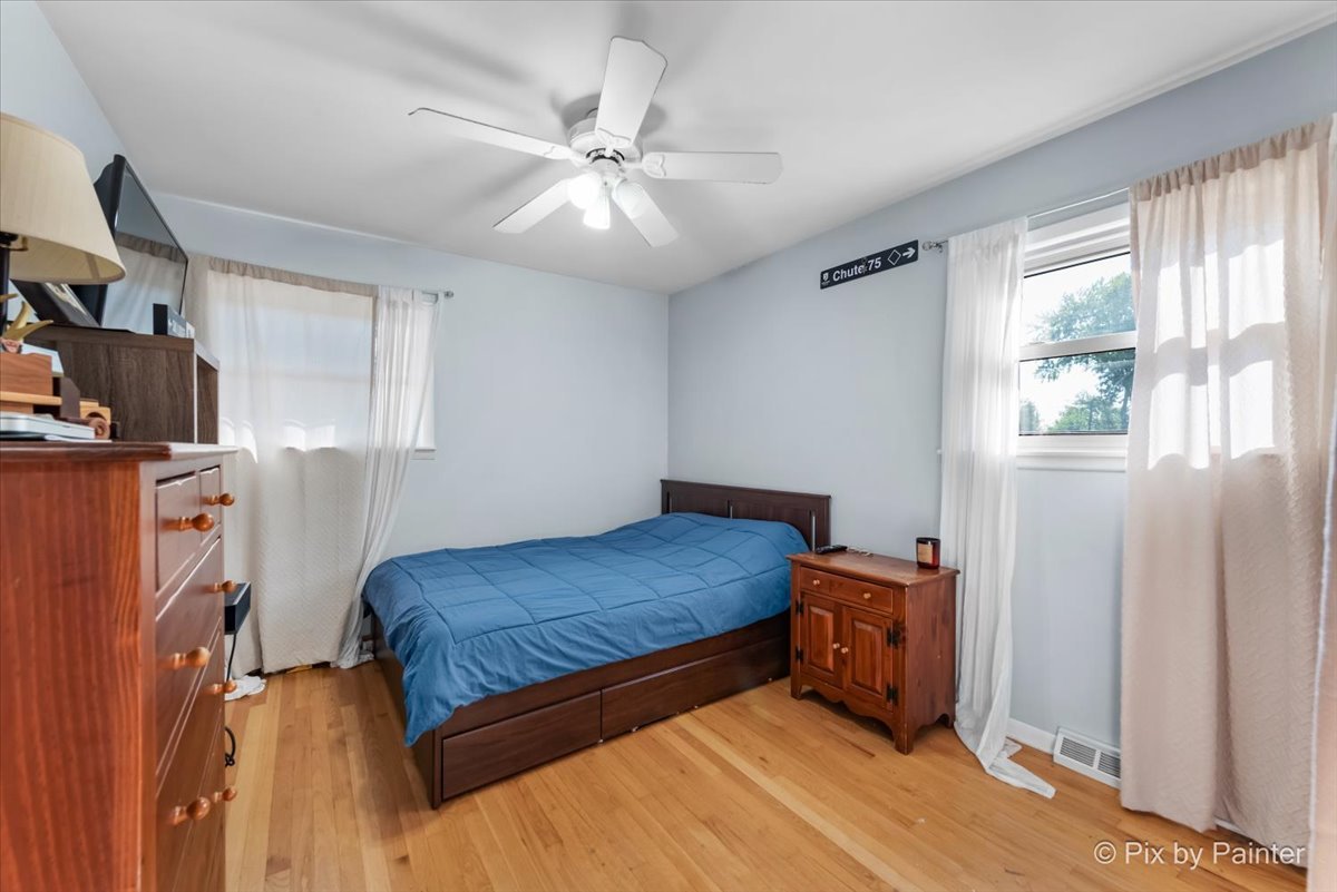 571 Lowden Avenue Glen Ellyn, IL 60137 - Photo 23 of 30 a bedroom with a bed and a window