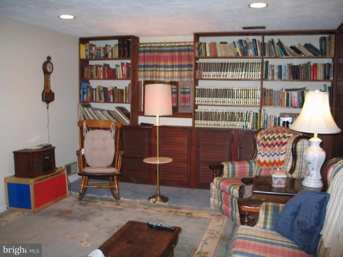 1007 Loxford Terrace Silver Spring, MD 20901 - Photo 13 of 15 a reading room with furniture and book shelf