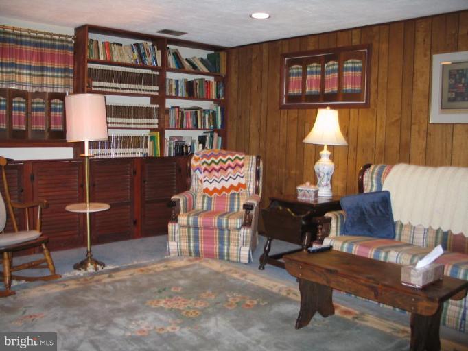 1007 Loxford Terrace Silver Spring, MD 20901 - Photo 10 of 15 a living room with furniture a lamp and a window