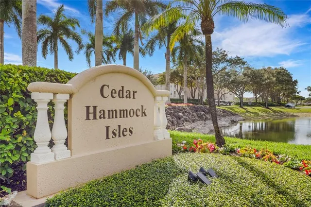 a sign on the side of the river