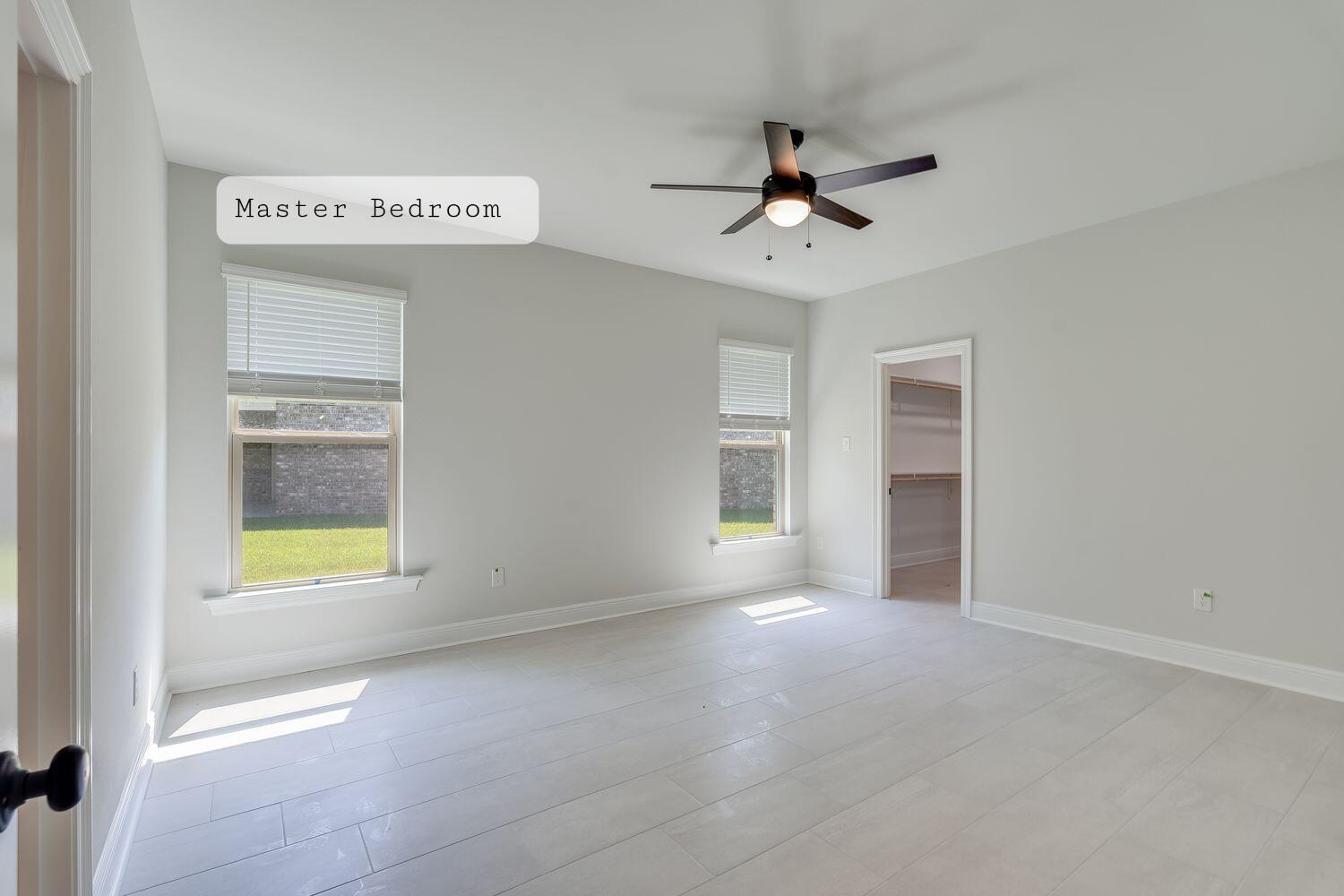 77 Eclipse Loop Freeport, FL 32439 - Photo 14 of 31 a view of an empty room with a window