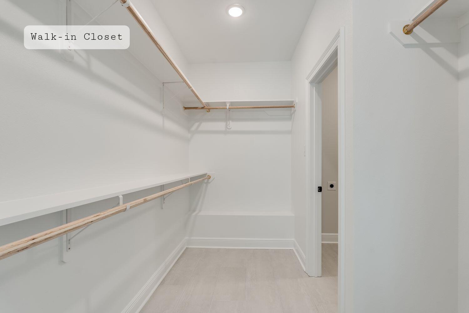 77 Eclipse Loop Freeport, FL 32439 - Photo 17 of 31 a view of walk in closet with empty racks