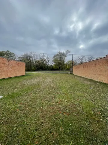 a view of a field with an ocean