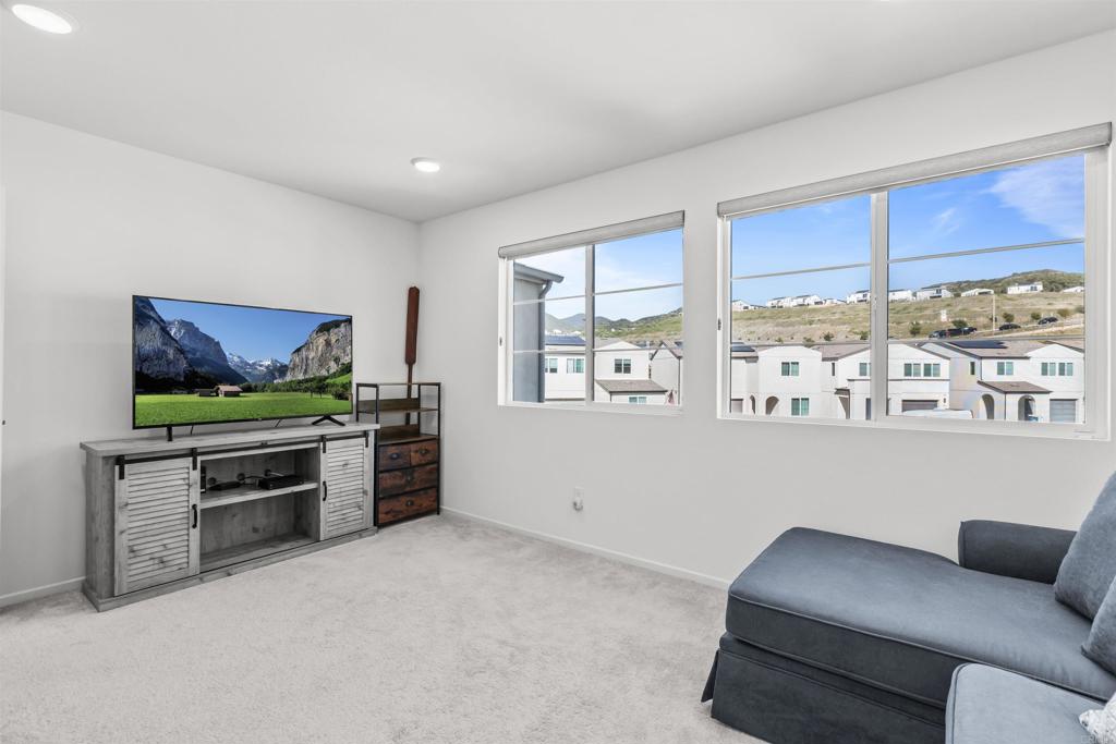 35076 Hacienda Heights Fallbrook, CA 92028 - Photo 23 of 32 a living room with furniture and a flat screen tv