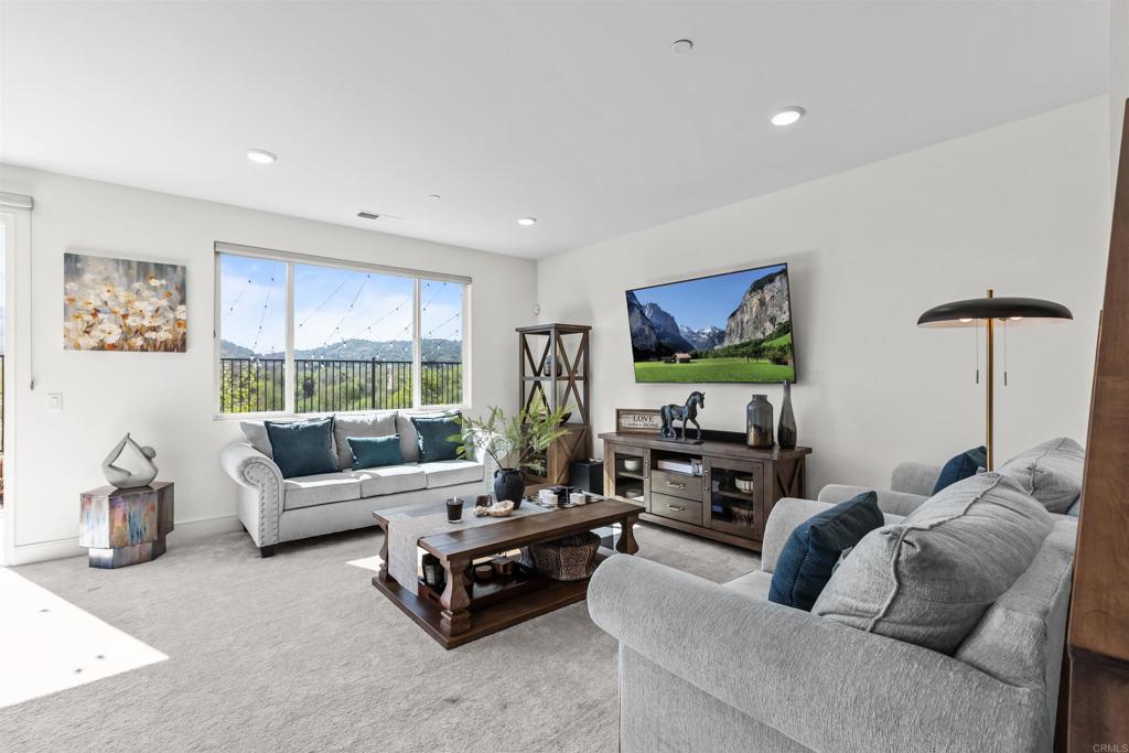 35076 Hacienda Heights Fallbrook, CA 92028 - Photo 7 of 32 a living room with furniture large window and a flat screen tv