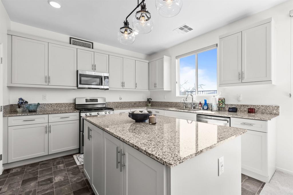 35076 Hacienda Heights Fallbrook, CA 92028 - Photo 10 of 32 a kitchen with stainless steel appliances granite countertop a sink stove and cabinets