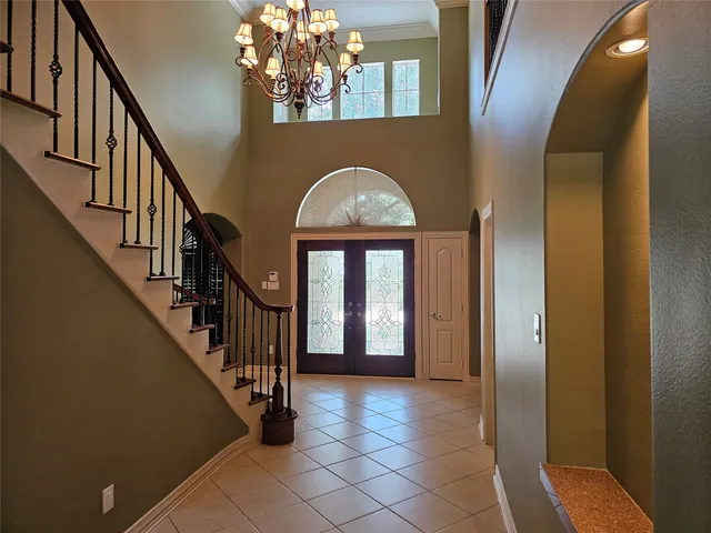 wooden floor with windows and entryway