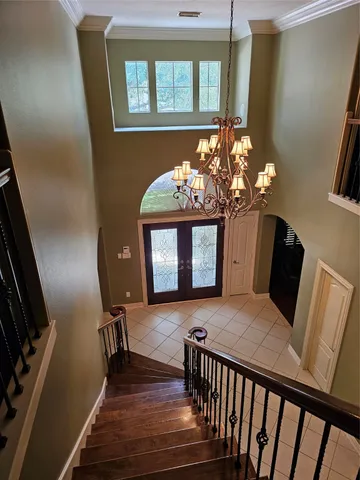 a view of a livingroom with wooden floor and furniture